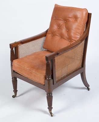 Lot 1057 - A George IV mahogany reading bergere, in the manner of Gillows.