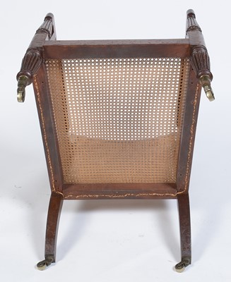Lot 1057 - A George IV mahogany reading bergere, in the manner of Gillows.