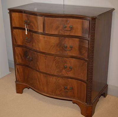Lot 4 - A George III style mahogany serpentine fronted chest.