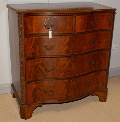 Lot 5 - A George III style mahogany serpentine fronted chest.