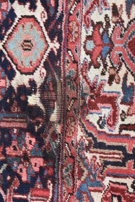 Lot 699 - A Heriz carpet