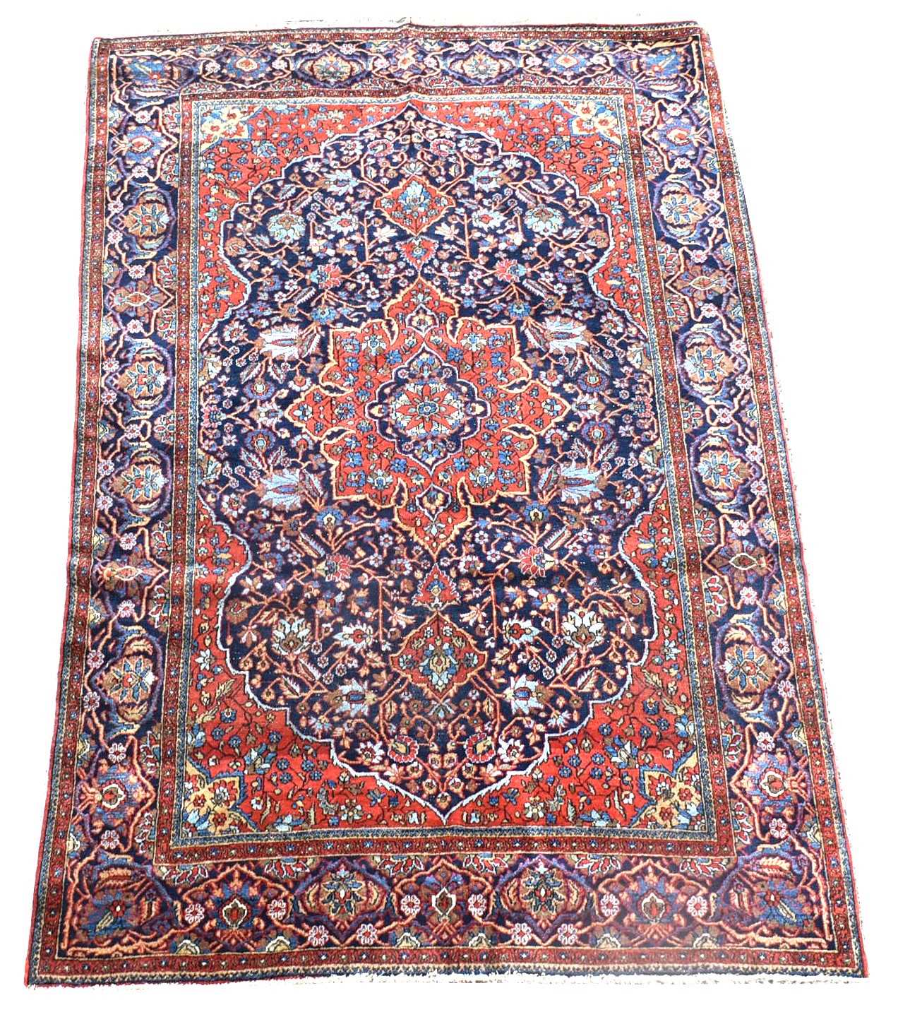 Lot 702 - An antique Kashan rug