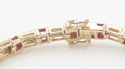 Lot 261 - A ruby and diamond tennis bracelet