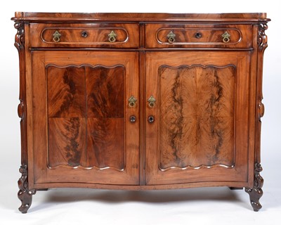 Lot 1043 - A Victorian carved mahogany serpentine front sideboard.