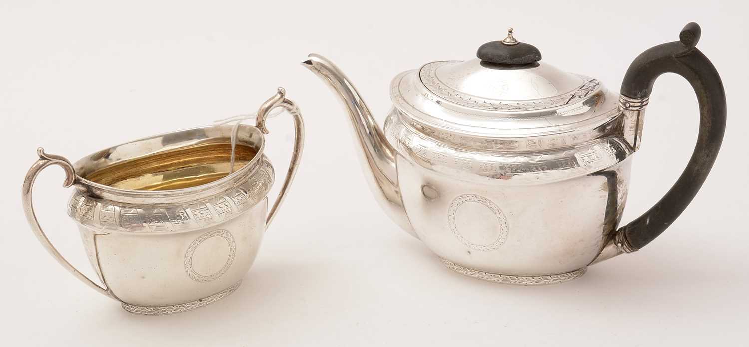 Lot 103 - A Victorian silver teapot and sugar bowl, by Edward Barnard & Sons Ltd