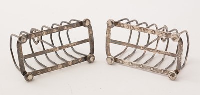 Lot 105 - A pair of silver seven-bar toast racks, by Maxfield & Sons Ltd