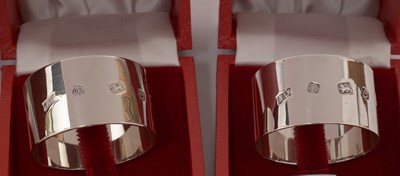 Lot 108 - Six silver napkin rings and a dish