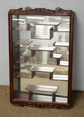 Lot 14 - A Chinese hardwood wall mounting display shelf