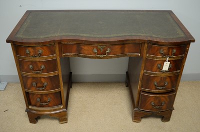Lot 74 - A small 20th Century mahogany serpentine pedestal desk
