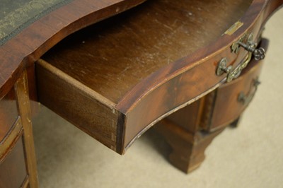 Lot 74 - A small 20th Century mahogany serpentine pedestal desk