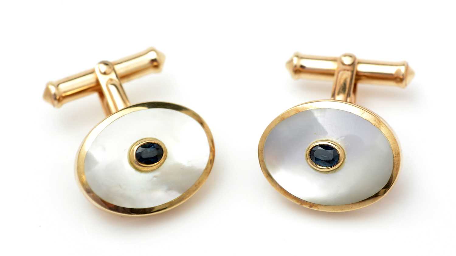 Lot 369 - A pair of sapphire and mother-of-pearl cufflinks