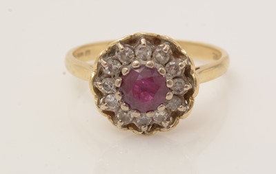 Lot 170 - A ruby and diamond cluster ring