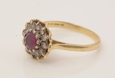 Lot 170 - A ruby and diamond cluster ring