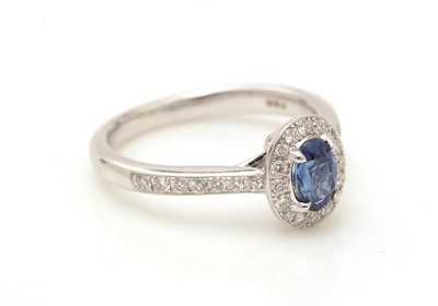 Lot 371 - A sapphire and diamond cluster ring