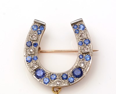Lot 372 - A sapphire and diamond horseshoe brooch