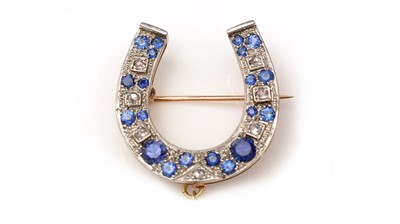 Lot 372 - A sapphire and diamond horseshoe brooch