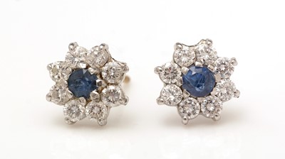 Lot 377 - A pair of sapphire and diamond cluster earrings