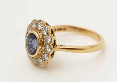 Lot 380 - A sapphire and diamond cluster ring