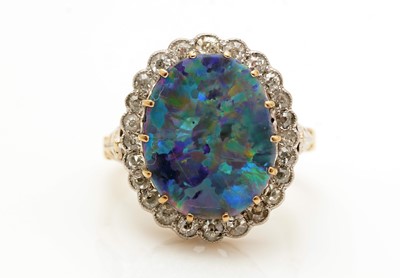 Lot 381 - An opal doublet and diamond cluster ring