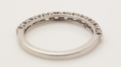 Lot 394 - A diamond half hoop eternity ring