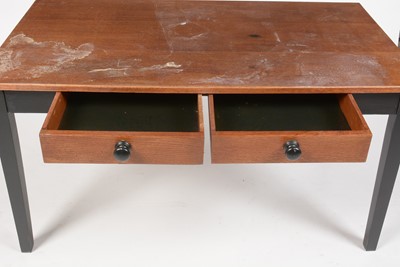 Lot 308 - A mid Century oak and ebonised desk.
