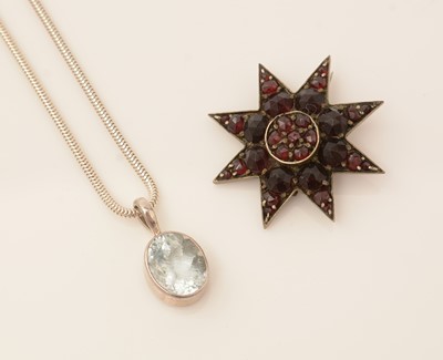 Lot 105 - Aquamarine pendant, garnet brooch and another pendant.