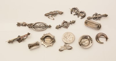 Lot 120 - A collection of late 19th/early 20th Century silver brooches.