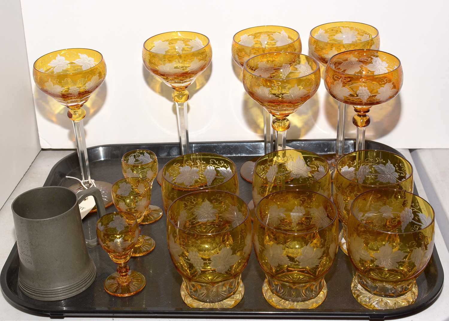 Lot 324 - A Bohemian clear and amber glass suite of glasses.