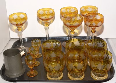 Lot 324 - A Bohemian clear and amber glass suite of glasses.