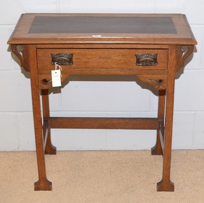 Lot 83 - An Arts & Crafts oak writing desk.