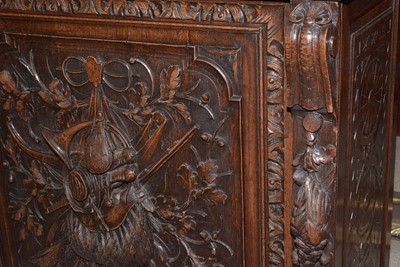 Lot 1310 - A richly carved Victorian oak side/pier cabinet with a sporting theme.