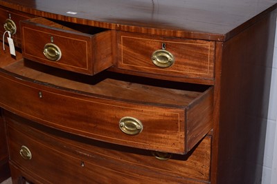 Lot 62 - A George III mahogany and line inlaid bowfront chest.