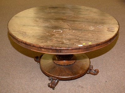 Lot 25 - A Victorian rosewood tilt action breakfast table.