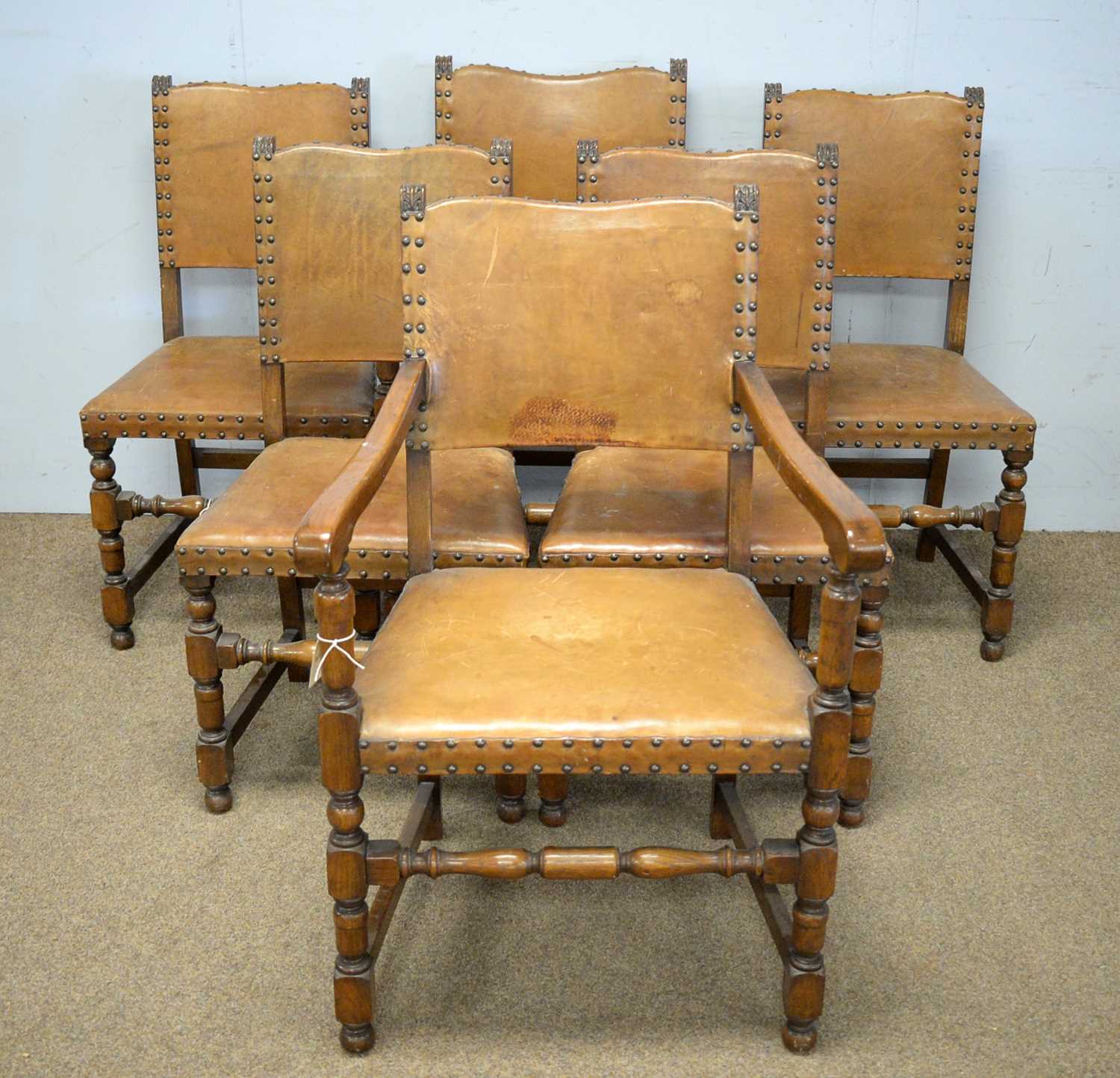 Lot 38 - A set of six light oak tan leather-covered dining chairs.