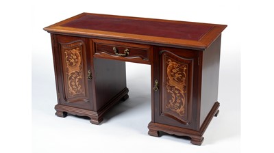 Lot 1306 - A late Victorian inlaid mahogany pedestal desk in the Arts & Crafts taste.