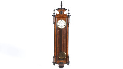 Lot 1159 - A Viennese burr walnut and ebonised quarter chiming wall clock.