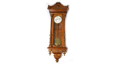 Lot 1161 - A Vienna walnut cased wall clock