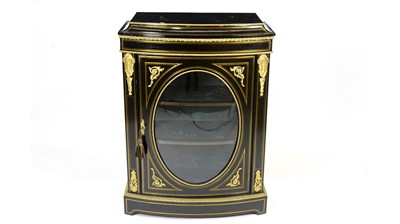 Lot 1309 - An ornate Victorian ebonised and gilt metal mounted bowfront display cabinet.