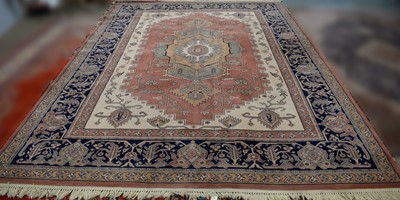 Lot 83 - A Heriz-style carpet by Ambassador.