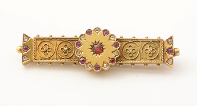 Lot 175 - A Victorian Etruscan revival ruby and diamond set gold brooch