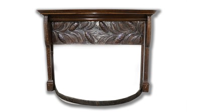 Lot 1258 - An Early 20th C Arts & Crafts embossed copper and mahogany fire surround.