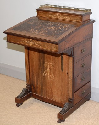 Lot 85 - A Victorian carved and inlaid rosewood Davenport.
