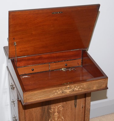 Lot 85 - A Victorian carved and inlaid rosewood Davenport.