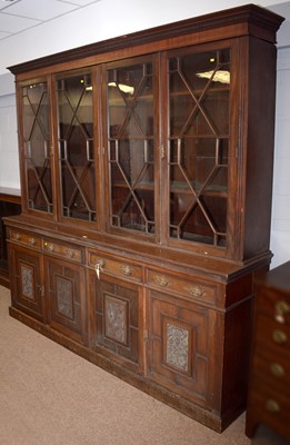 Lot 64 - A late Victorian carved mahogany library bookcase.