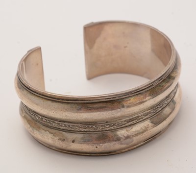 Lot 149 - An Egyptian silver bangle, and another bangle and other items.