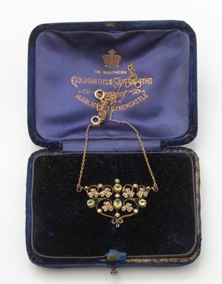 Lot 260 - An Edwardian peridot and seed pearl pendant