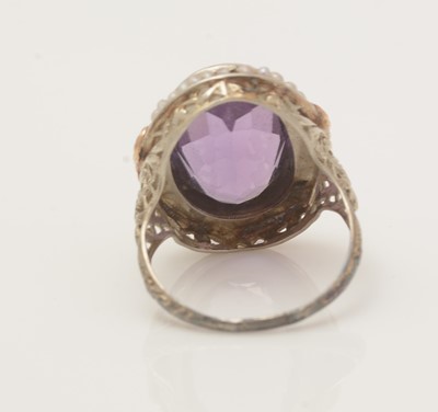 Lot 411 - An amethyst and seed pearl dress ring