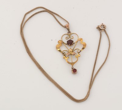 Lot 283 - An Edwardian red stone and 9ct yellow gold pendant on chain