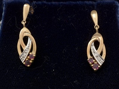 Lot 287 - A pair of 9ct yellow gold, ruby and diamond drop earrings.