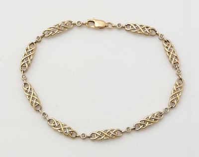 Lot 288 - A 9ct yellow gold and diamond bracelet